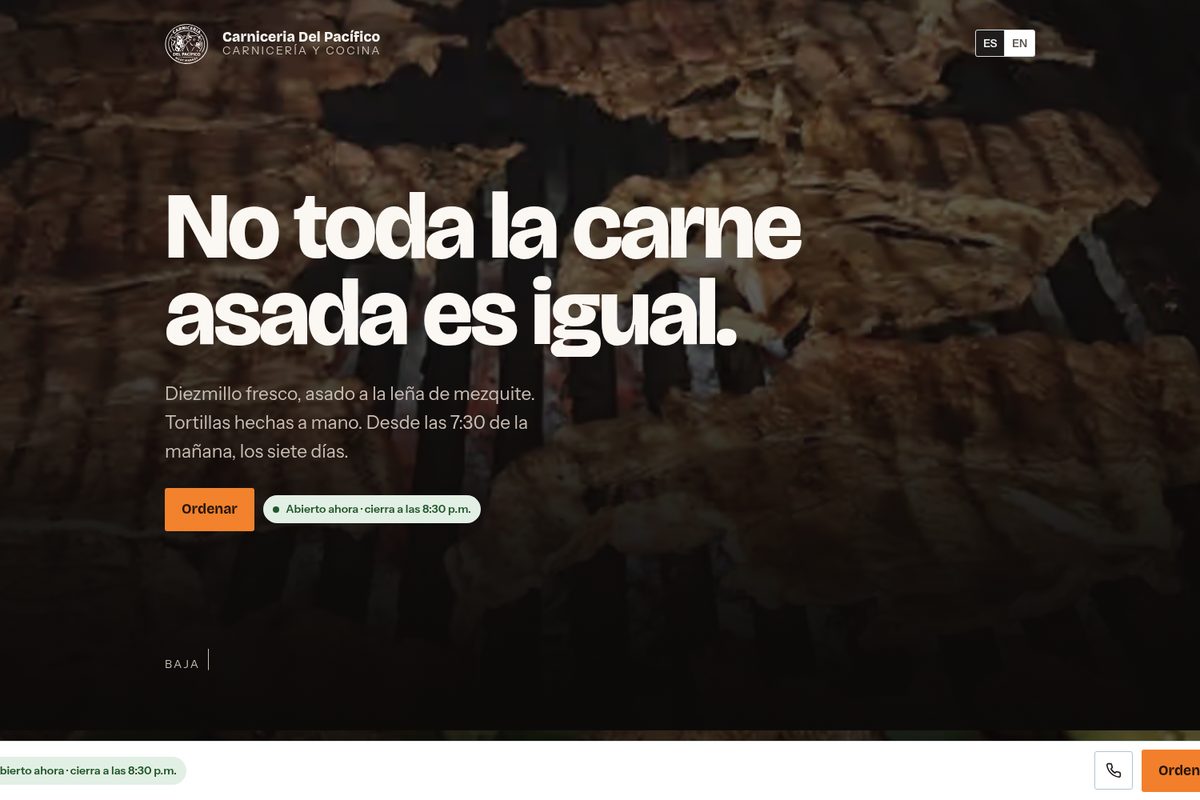 Carniceria Del Pacifico: carne asada on a mesquite grill behind the headline No toda la carne asada es igual.